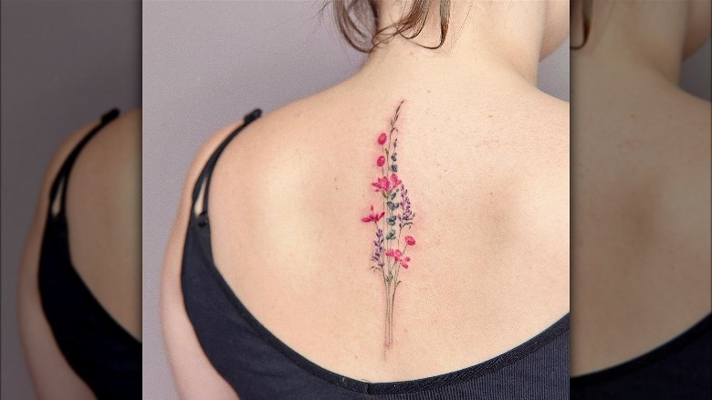 Wild flower back tattoo