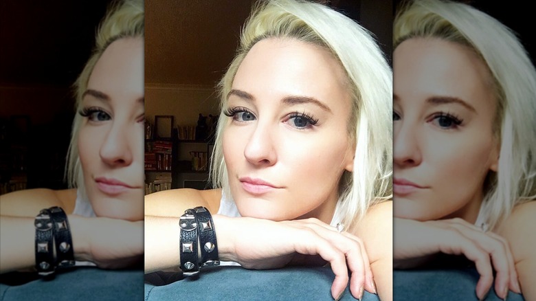 A selfie of a woman with blonde hair and intense eyelashes