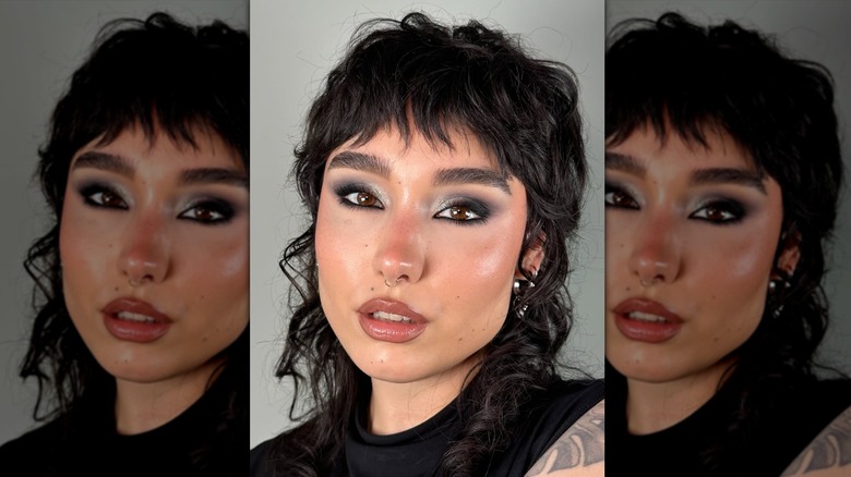 A woman with smokey silver eye shadow