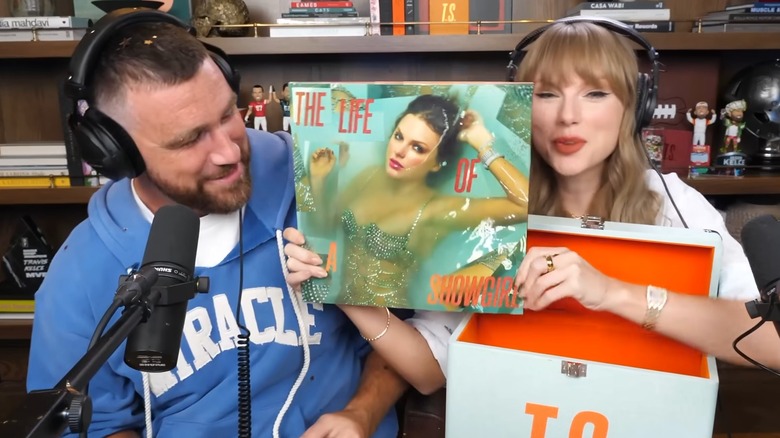 Taylor Swift debuting the cover of "The Life of a Showgirl" on the New Heights podcast