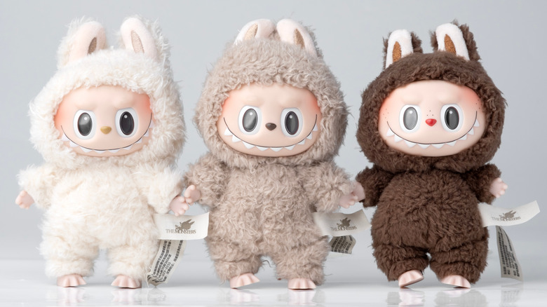 Three Labubu toys standing together