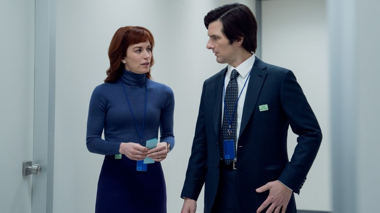 Still of Britt Lower and Adam Scott as Helly R. and Mark S. in Severance