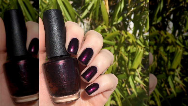 A woman wearing the OPI shade Every Month is Oktoberfest on Instagram