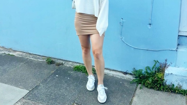 woman posing in skirt