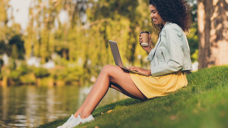 woman with coffee and laptop