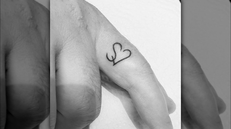 Ring finger tattoo
