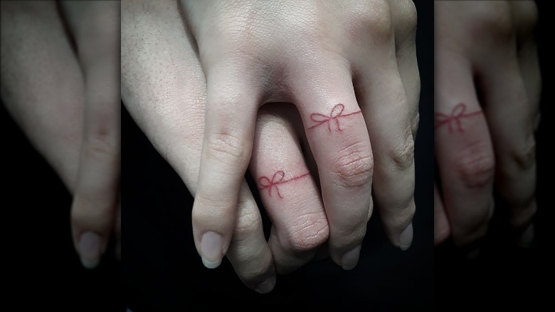 String heart tattoo