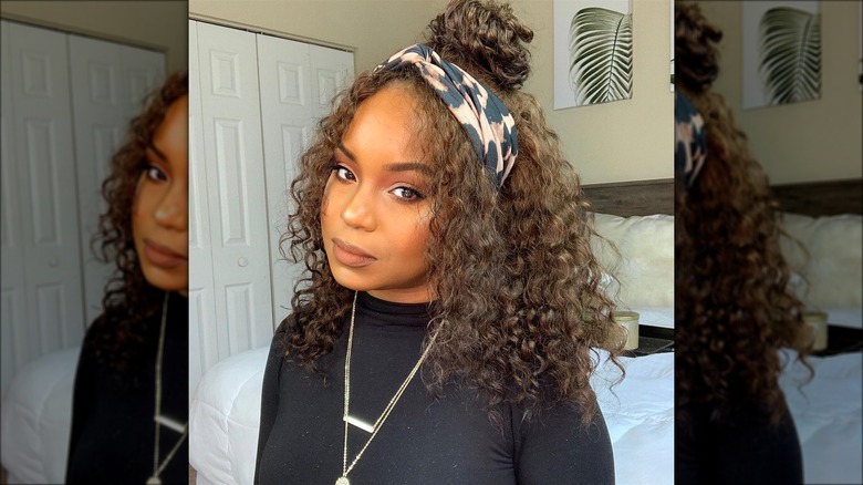 Woman with a topknot and headband