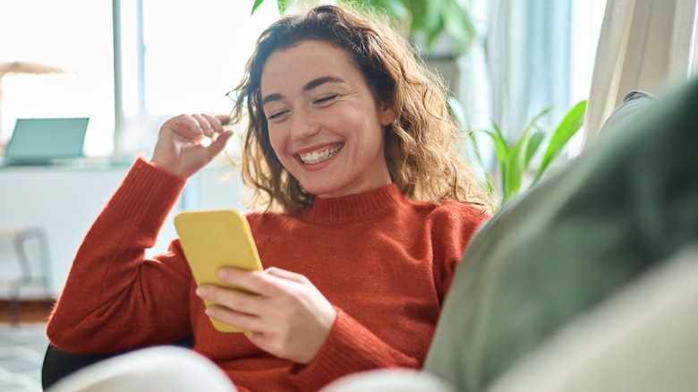 woman holding cell phone 