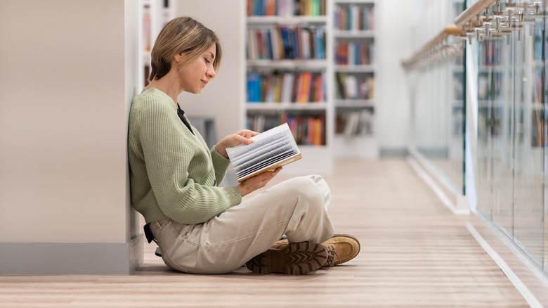 Sitting on floor reading