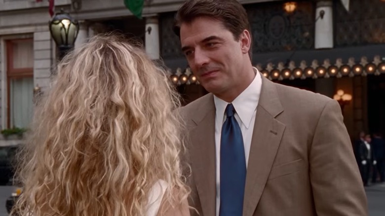 Carrie Bradshaw (from the back) looking at Mr. Big in Sex & The City