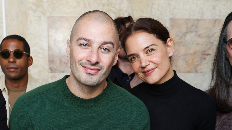 Katie Holmes sitting and smiling with Jason Bard Yarmosky