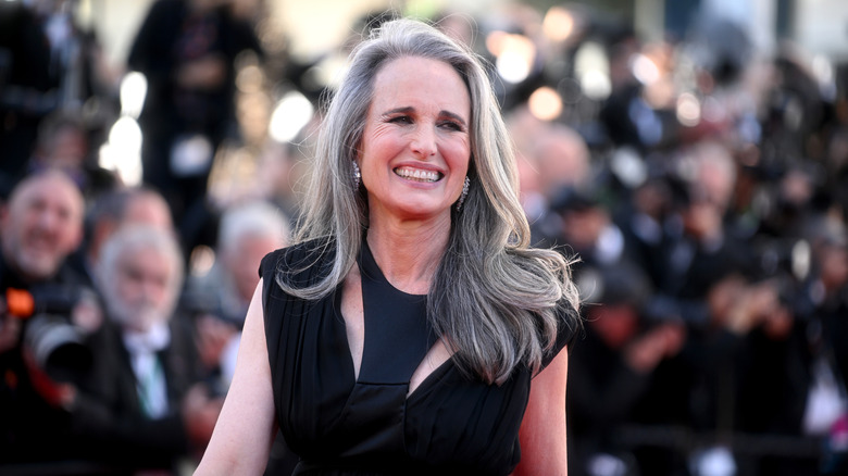 Andie McDowell on the red carpet while smiling