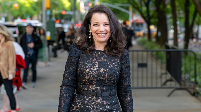 Fran Drescher on the street in a lace body con dress