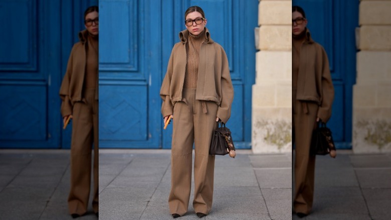 Woman in dark tan outfit