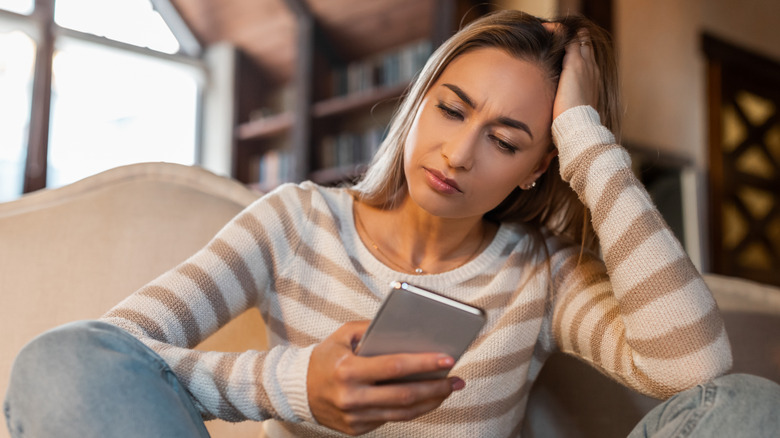 woman looking at her phone