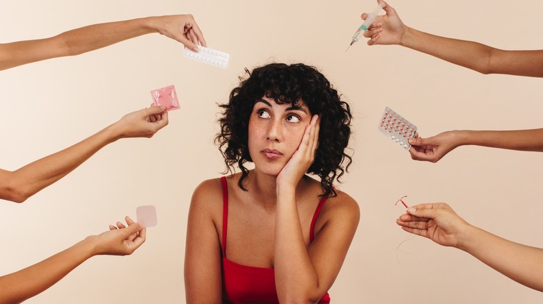 Woman considering different birth control options 