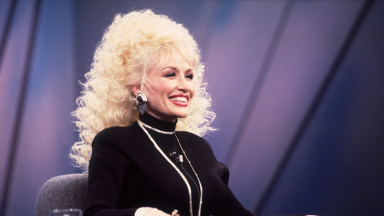 Dolly Parton on the Oprah Winfrey show wearing a black turtleneck