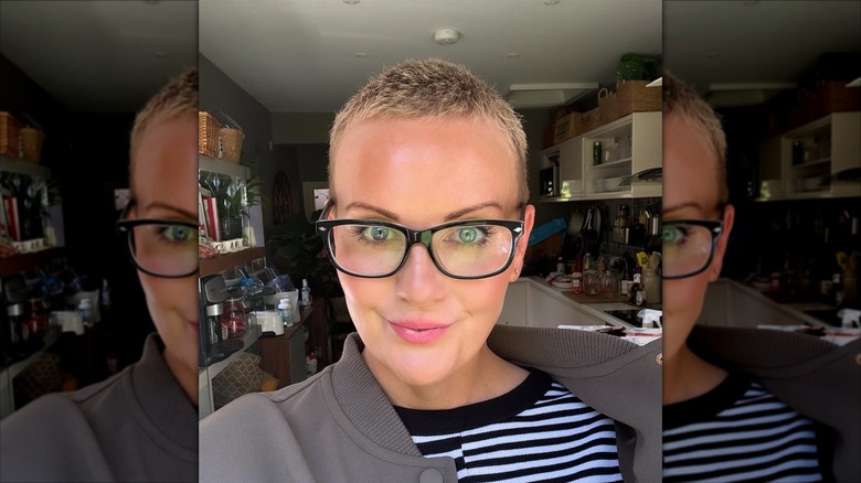 A woman with cropped hair