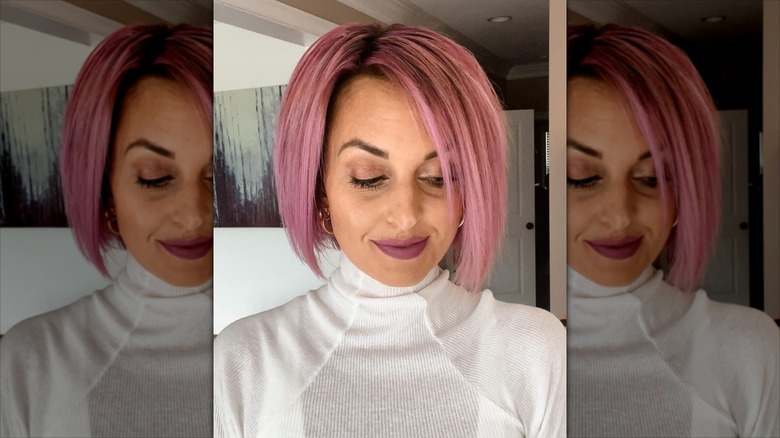 A woman with an asymmetric bob with sideswept bangs