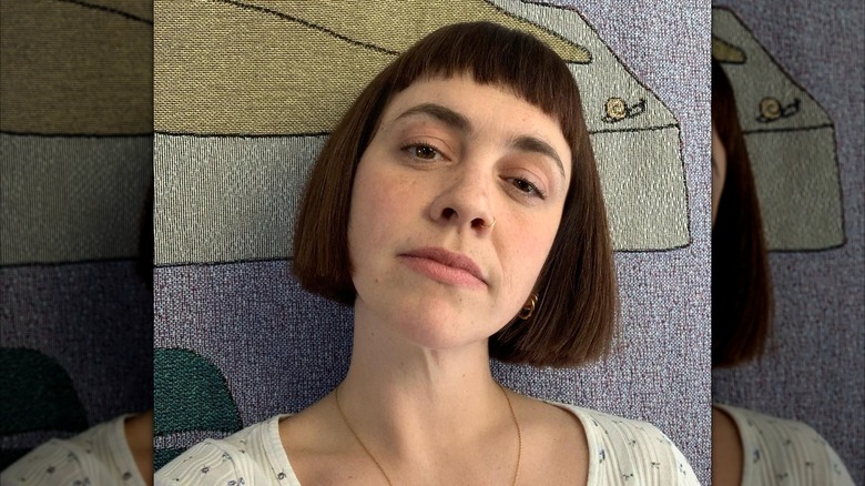 A woman with baby bangs and a short bob