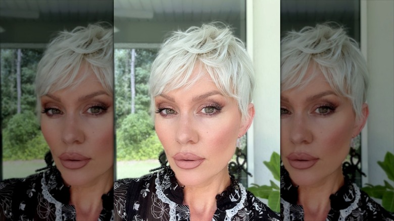 A woman with a choppy, layered, long pixie