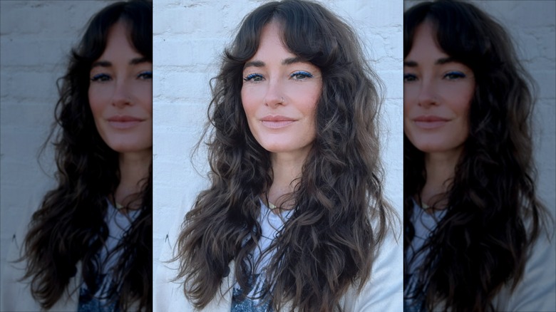 A woman with long, shaggy hair