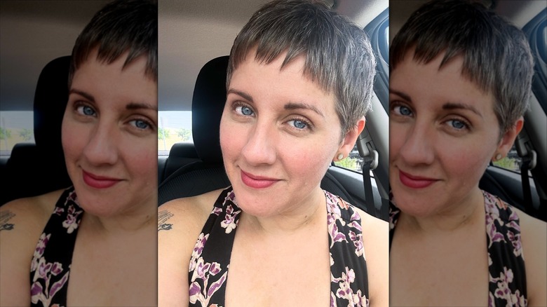 A woman with a pixie cut and bangs