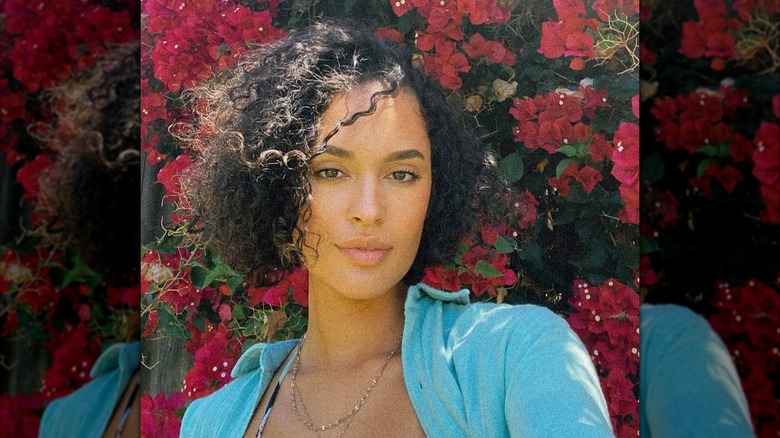 A woman with a curly bob