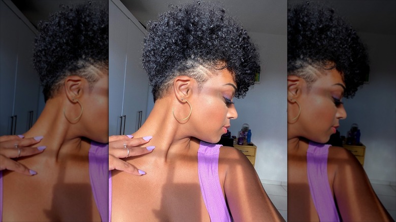 A woman with a tapered cut and curls