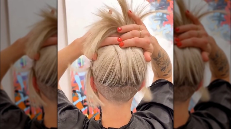 A woman with an undercut bob