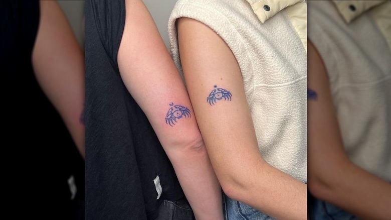 Matching crab tattoos
