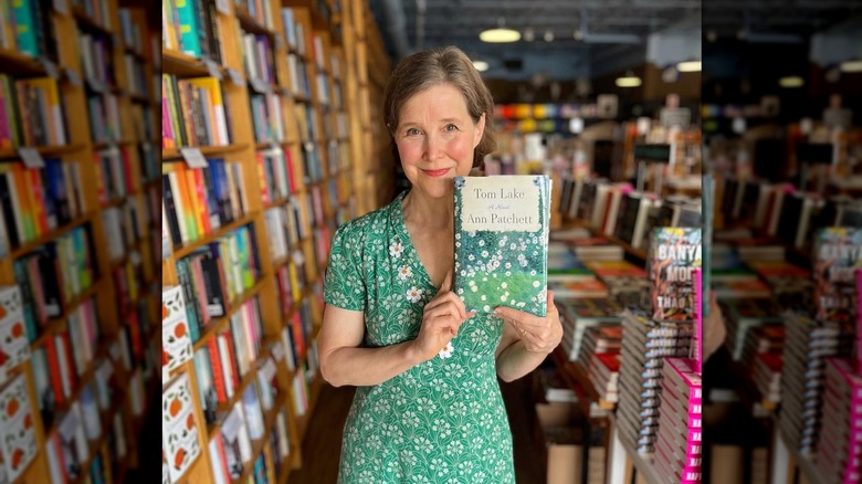 Ann Patchet posing with a copy of her novel "Tom Lake" in Parnassus Books
