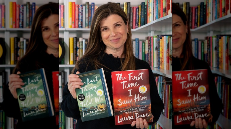 Laura Dave posing with her two books, "The Last Thing He Told Me" and "The First Time I Saw Him"