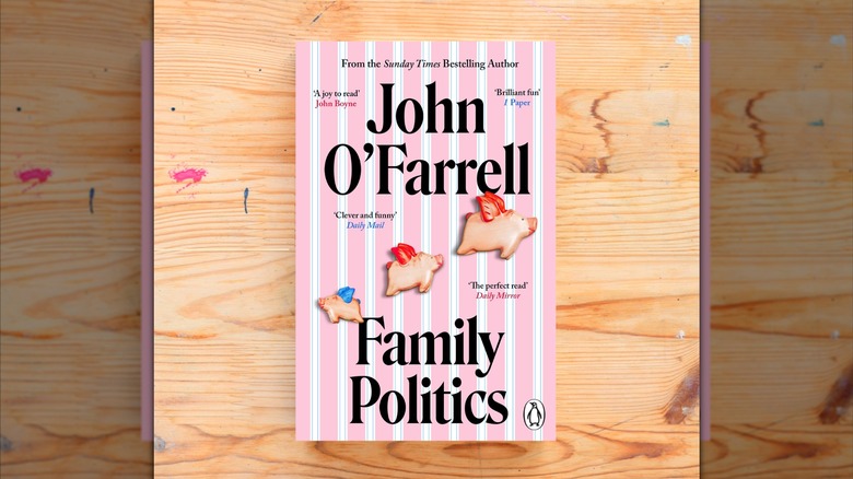 A copy of "Family Politics" laying on a wooden table