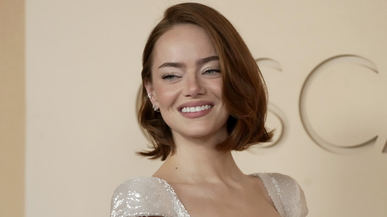 Emma Stone smiles on the red carpet in 2026