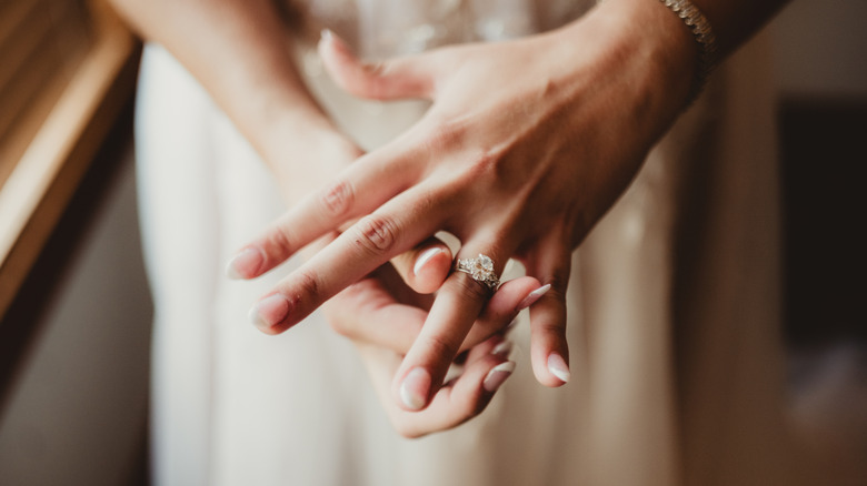 Bride flashing her engagement ring