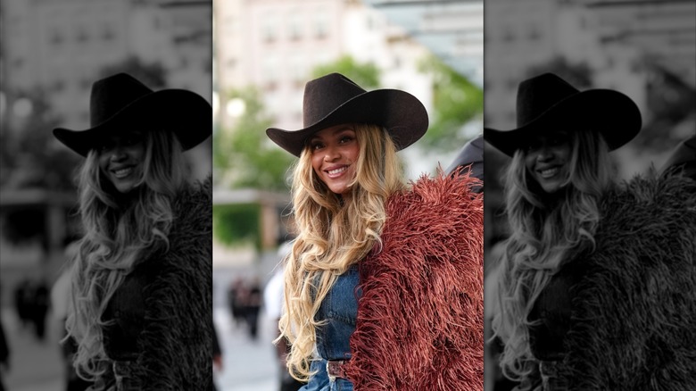 Beyonce pictured smiling outside of a Louis Vuitton fashion show in 2026