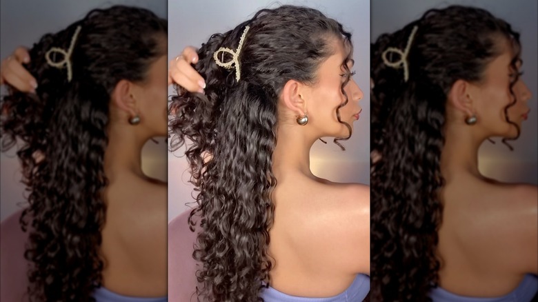 A woman with a bedazzled claw clip in her hair