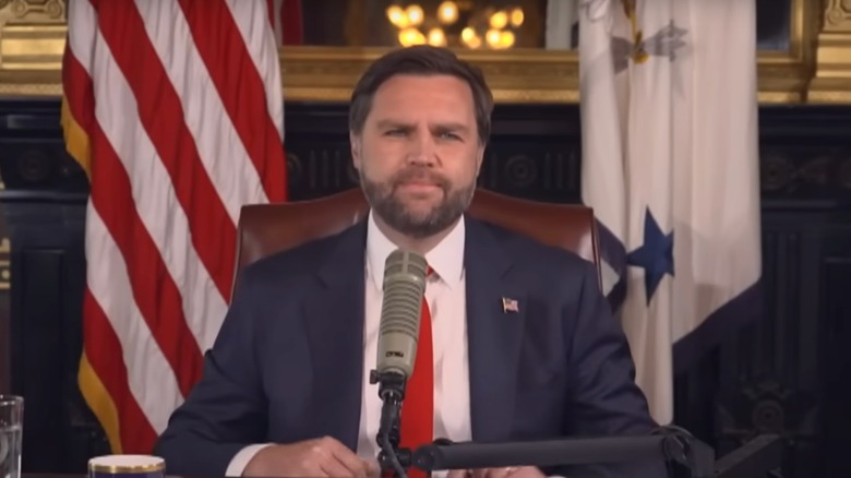 A shot of JD Vance hosting Charlie Kirk's podcast to celebrate his life