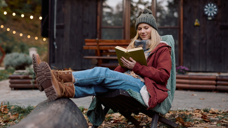 Woman reading a book outside