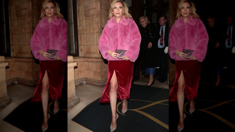 Woman wearing a pink faux fur coat