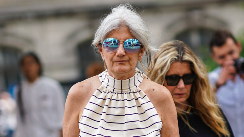 A guest wears mirrored sunglasses outside Paul Smith during Paris Fashion Week - Menswear Spring/Summer 2020, on June 23, 2019 in Paris, France