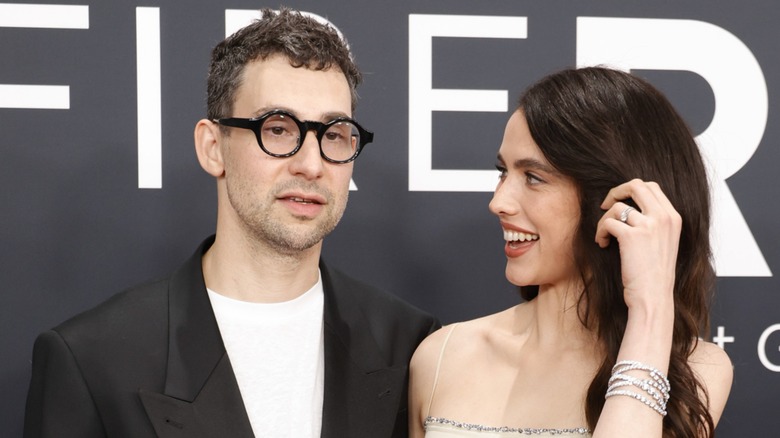 Margaret Qualley looking at Jack Antonoff on the red carpet