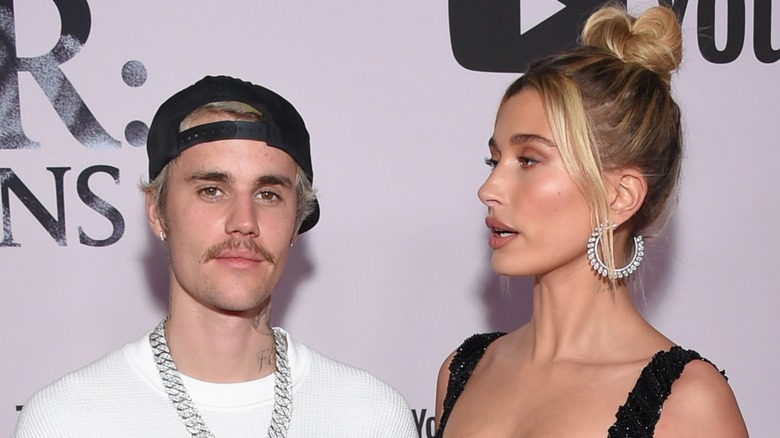 Hailey Bieber looking at Justin Bieber on the red carpet