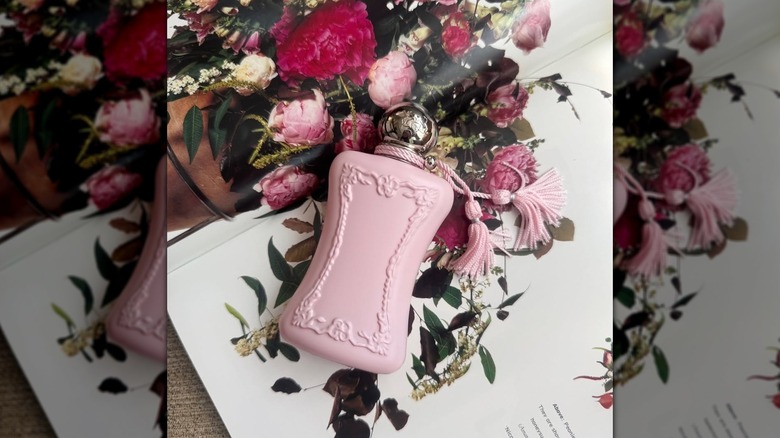Parfums de Marly Delina against an open page