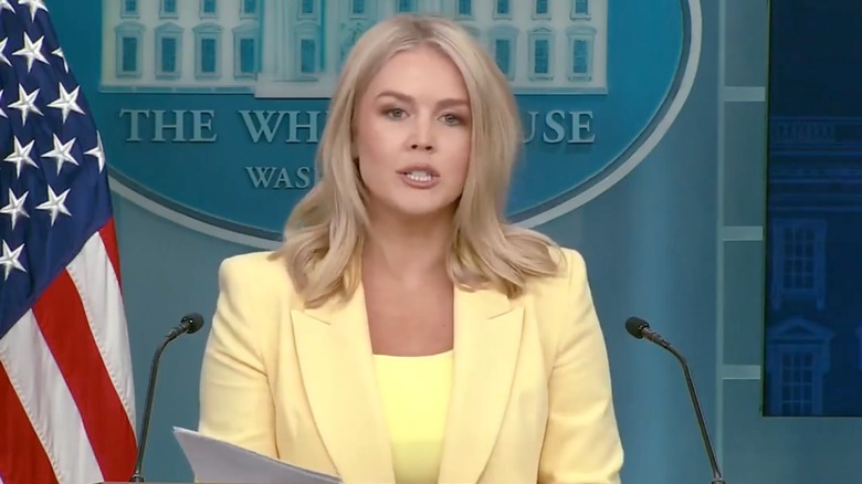 Karoline Leavitt in a yellow blazer and shirt on Twitter