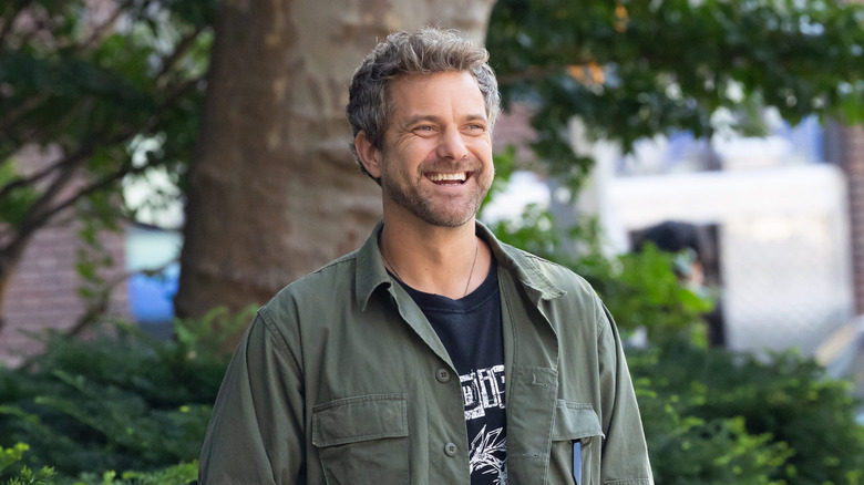 Joshua Jackson laughing on the set of "Happy Hours" in 2025