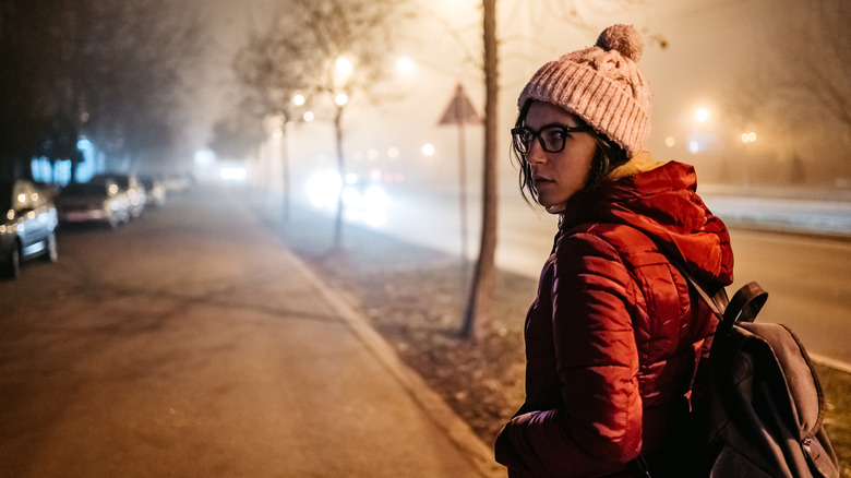 upset woman walks alone