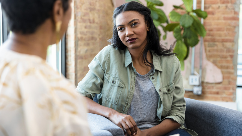 woman listens to therapist